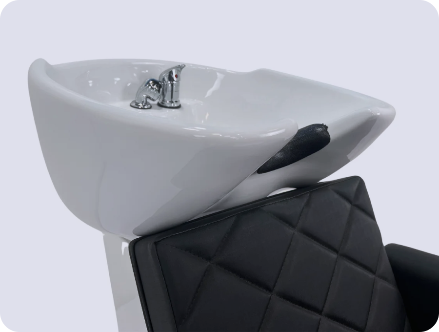 A black leather armchair with dark wood arms in a modern room setting.